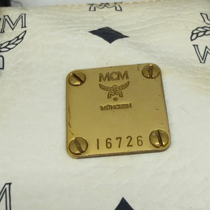 https://cdn.shopify.com/s/files/1/0564/9376/8855/files/MCM_Handtasche_Mini_Boston_mit_Umhangegurt_visetos_weiss_vintage8339.webp?v=1780408946
