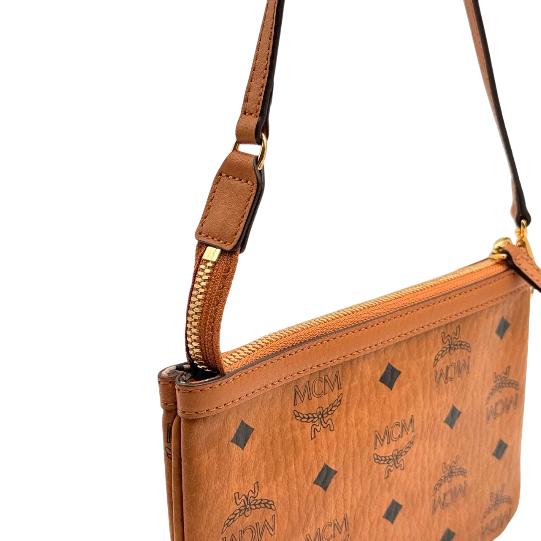 https://cdn.shopify.com/s/files/1/0564/9376/8855/files/MCM_Pochette_small_visetos_braun_14.webp?v=1784804534