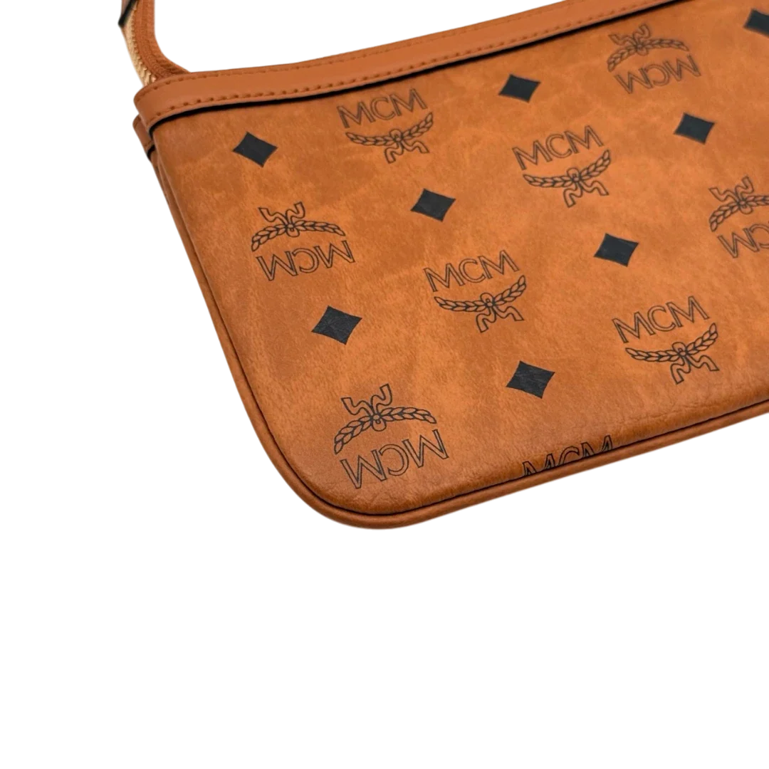 https://cdn.shopify.com/s/files/1/0564/9376/8855/files/MCM_Pochette_small_visetos_braun_7.webp?v=1784804533