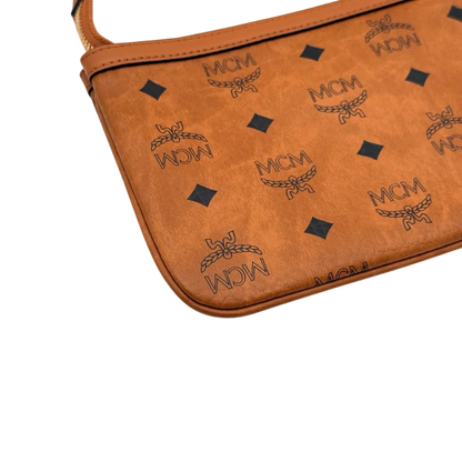 https://cdn.shopify.com/s/files/1/0564/9376/8855/files/MCM_Pochette_small_visetos_braun_7.webp?v=1784804533