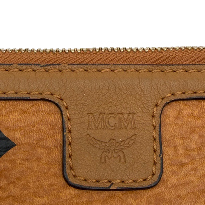 https://cdn.shopify.com/s/files/1/0564/9376/8855/files/MCM_Pochette_visetos_braun_10.webp?v=1781855350