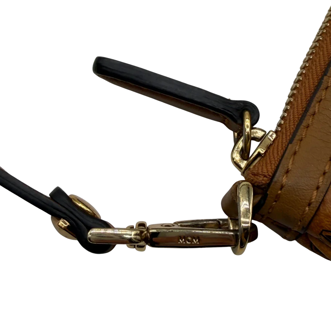 https://cdn.shopify.com/s/files/1/0564/9376/8855/files/MCM_Pochette_visetos_braun_11.webp?v=1781855350
