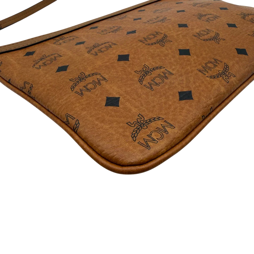 https://cdn.shopify.com/s/files/1/0564/9376/8855/files/MCM_Pochette_visetos_braun_8.webp?v=1781855350