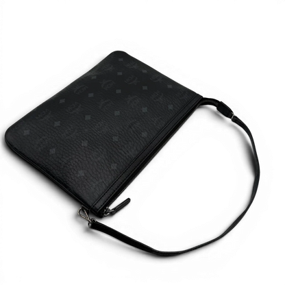 https://cdn.shopify.com/s/files/1/0564/9376/8855/files/MCM_Pochette_visetos_schwarz_10.webp?v=1781855869