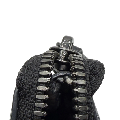 https://cdn.shopify.com/s/files/1/0564/9376/8855/files/MCM_Pochette_visetos_schwarz_13.webp?v=1781855869