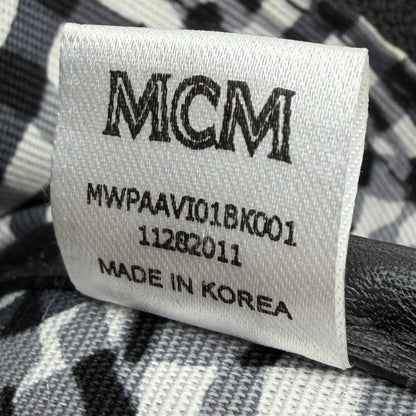 https://cdn.shopify.com/s/files/1/0564/9376/8855/files/MCM_Pochette_visetos_schwarz_16.webp?v=1781855869