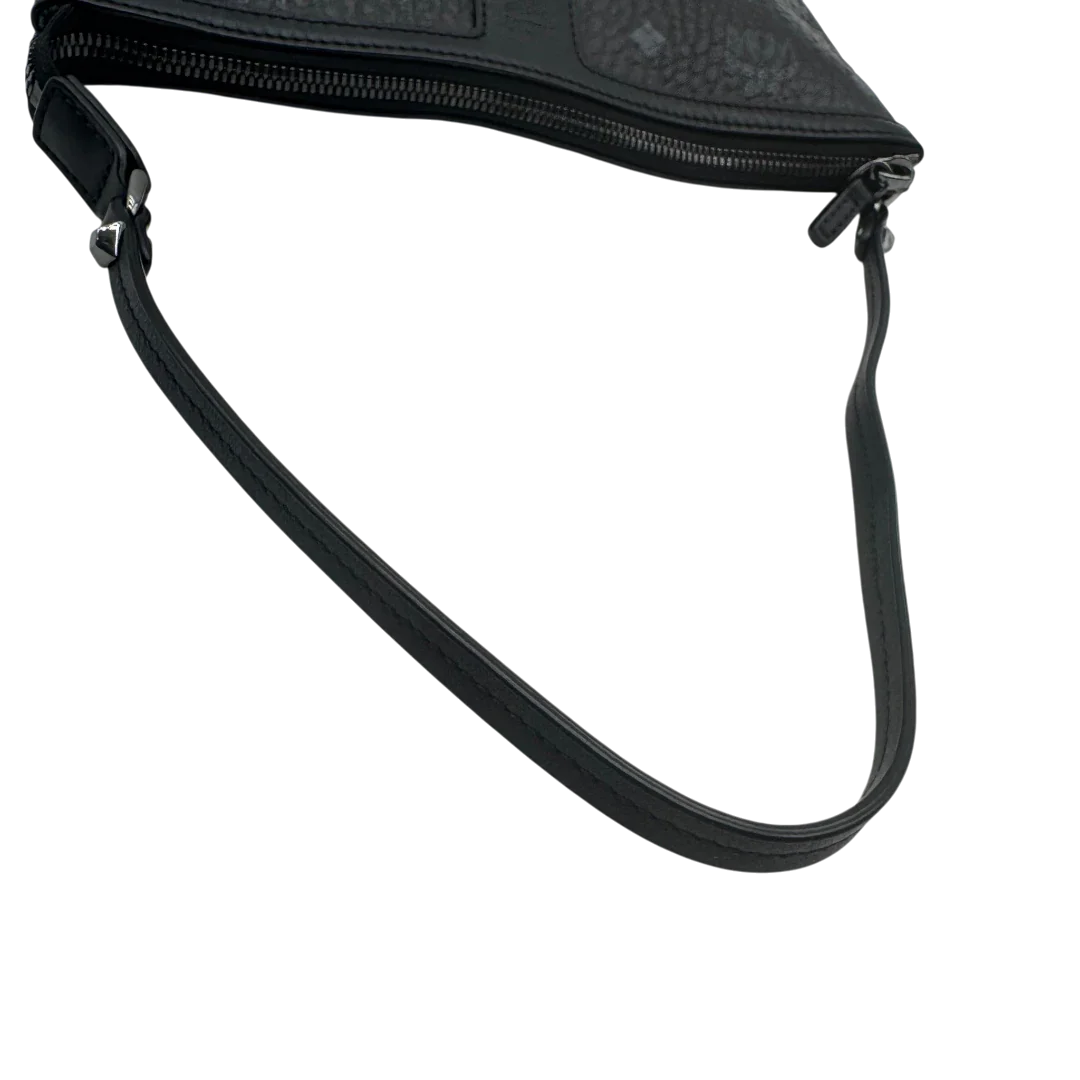 https://cdn.shopify.com/s/files/1/0564/9376/8855/files/MCM_Pochette_visetos_schwarz_vintage1798.webp?v=1779406675