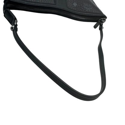 https://cdn.shopify.com/s/files/1/0564/9376/8855/files/MCM_Pochette_visetos_schwarz_vintage1798.webp?v=1779406675