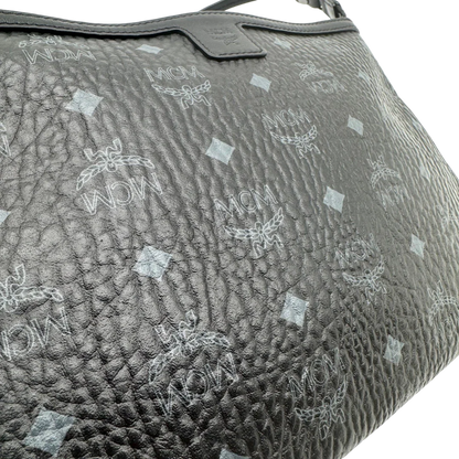 https://cdn.shopify.com/s/files/1/0564/9376/8855/files/MCM_Pochette_visetos_schwarz_vintage1802.webp?v=1779406676