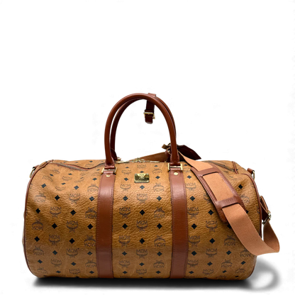 https://cdn.shopify.com/s/files/1/0564/9376/8855/files/MCM_Reisetasche_50_Zylinderform_visetos_braun_vintage_dufflebag4037.webp?v=1764296229