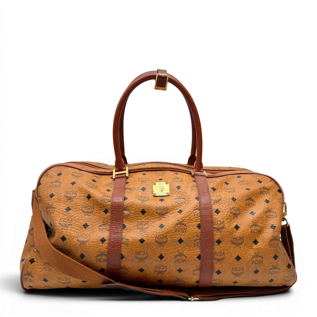 https://cdn.shopify.com/s/files/1/0564/9376/8855/files/MCM_Reisetasche_55_vintage_mit_Schultergurt_visetos_braun_1.webp?v=1784125618