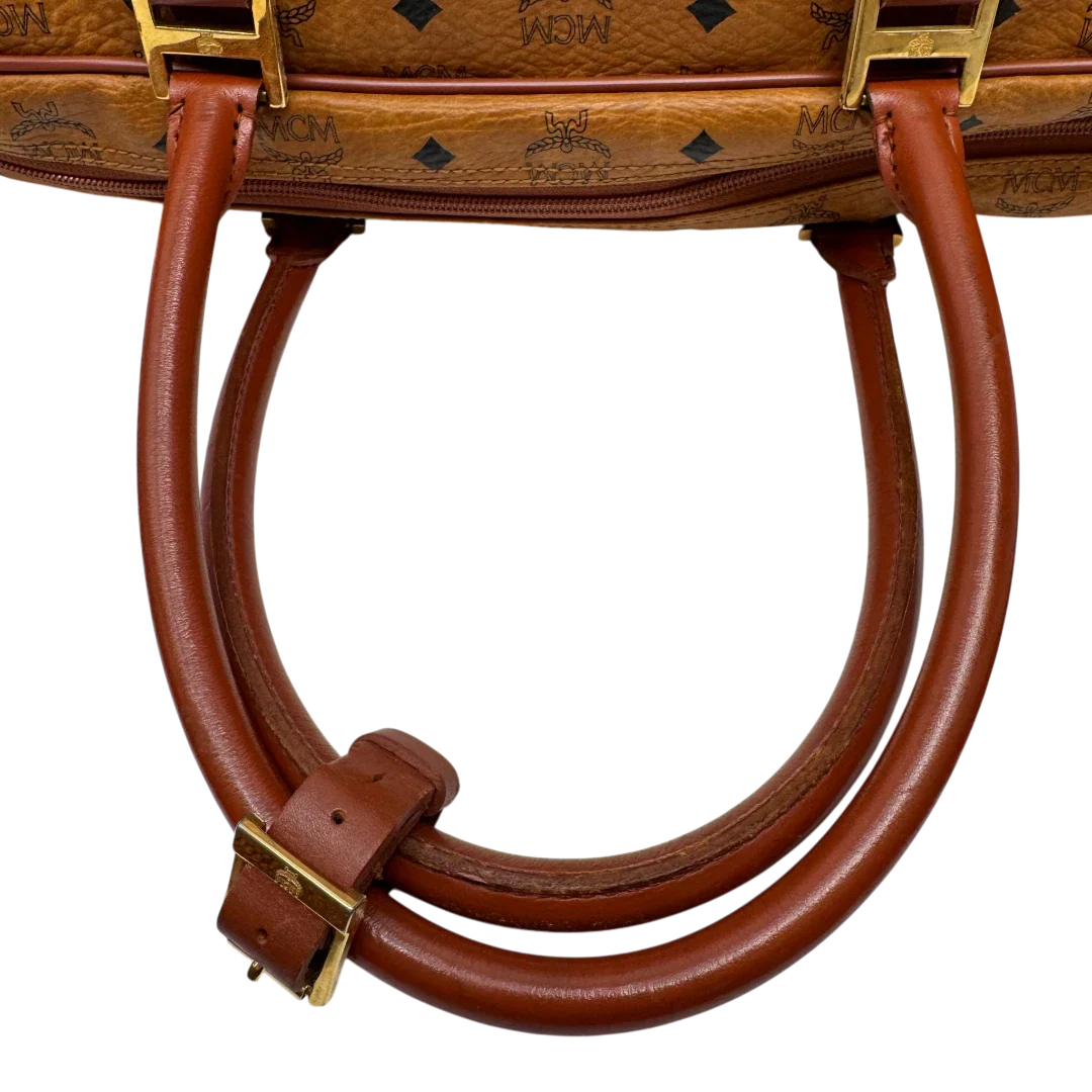 https://cdn.shopify.com/s/files/1/0564/9376/8855/files/MCM_Reisetasche_55_vintage_mit_Schultergurt_visetos_braun_10.webp?v=1784125617