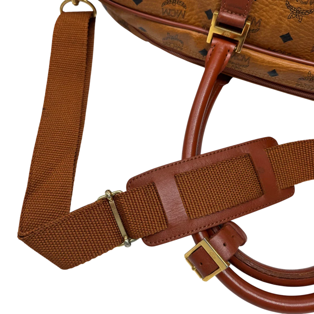 https://cdn.shopify.com/s/files/1/0564/9376/8855/files/MCM_Reisetasche_55_vintage_mit_Schultergurt_visetos_braun_11.webp?v=1784125617