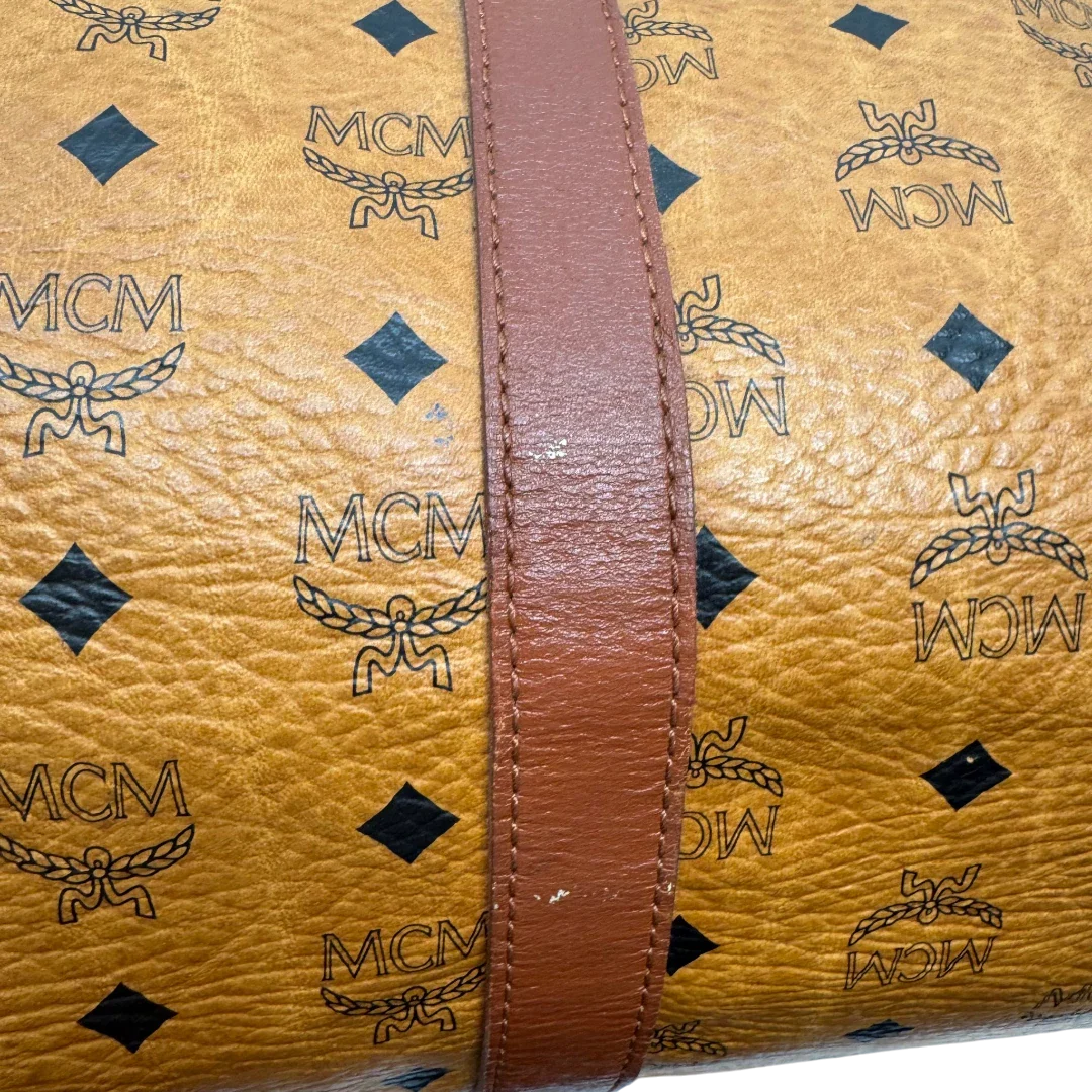 https://cdn.shopify.com/s/files/1/0564/9376/8855/files/MCM_Reisetasche_55_vintage_mit_Schultergurt_visetos_braun_18.webp?v=1784125617
