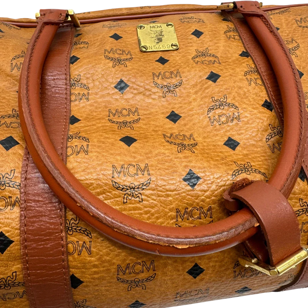 https://cdn.shopify.com/s/files/1/0564/9376/8855/files/MCM_Reisetasche_55_vintage_mit_Schultergurt_visetos_braun_21.webp?v=1784125617