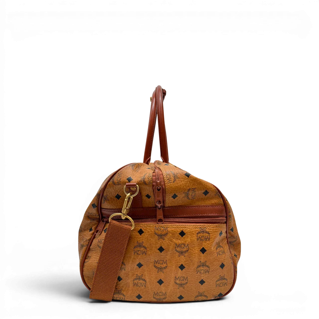 https://cdn.shopify.com/s/files/1/0564/9376/8855/files/MCM_Reisetasche_55_vintage_mit_Schultergurt_visetos_braun_3.webp?v=1784125617