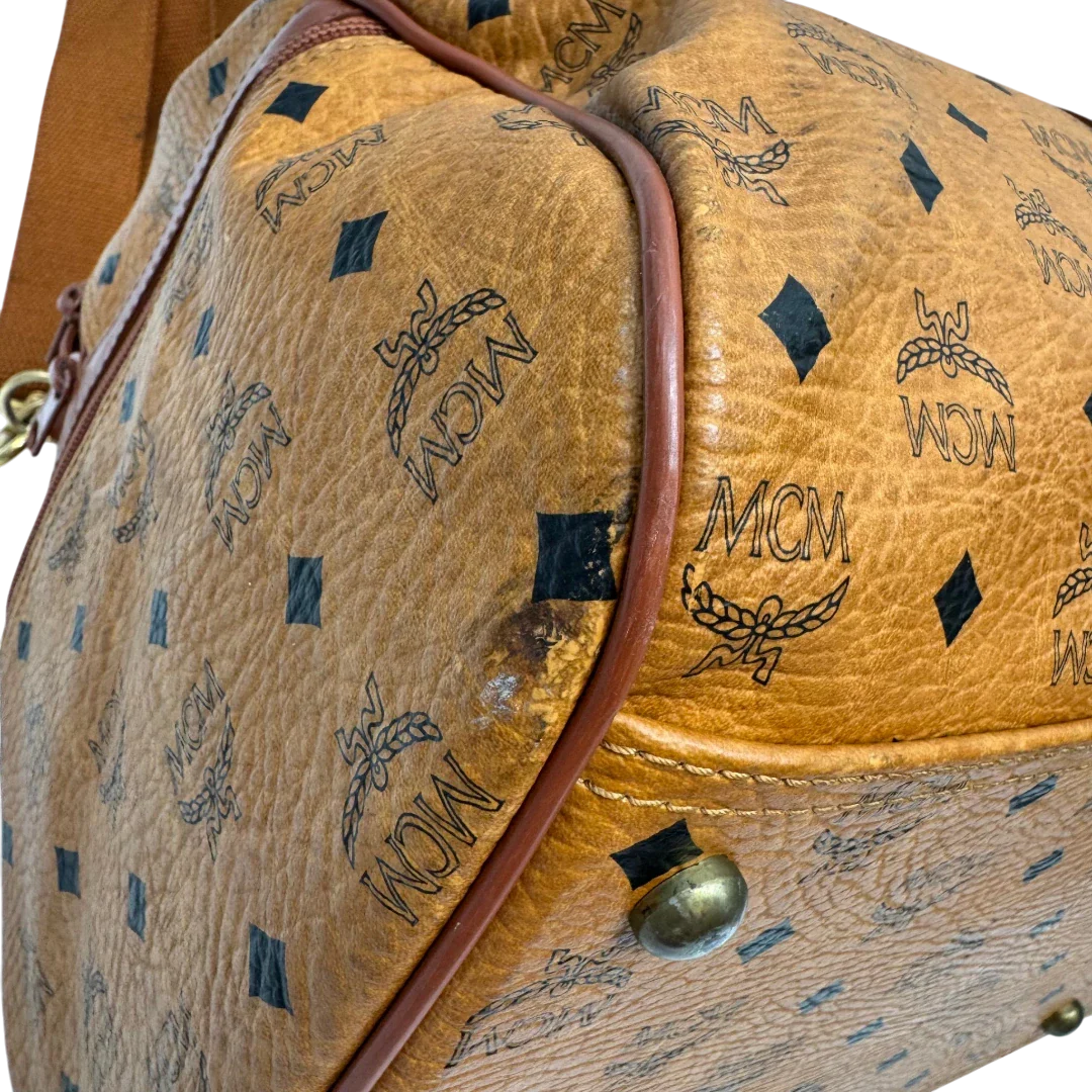 https://cdn.shopify.com/s/files/1/0564/9376/8855/files/MCM_Reisetasche_55_vintage_mit_Schultergurt_visetos_braun_8.webp?v=1784125618