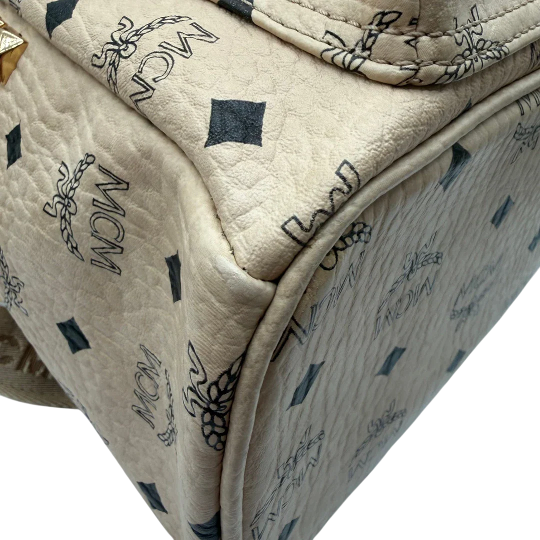 https://cdn.shopify.com/s/files/1/0564/9376/8855/files/MCM_Rucksack_Stark_medium_visetos_beige_vintage8396.webp?v=1781108985
