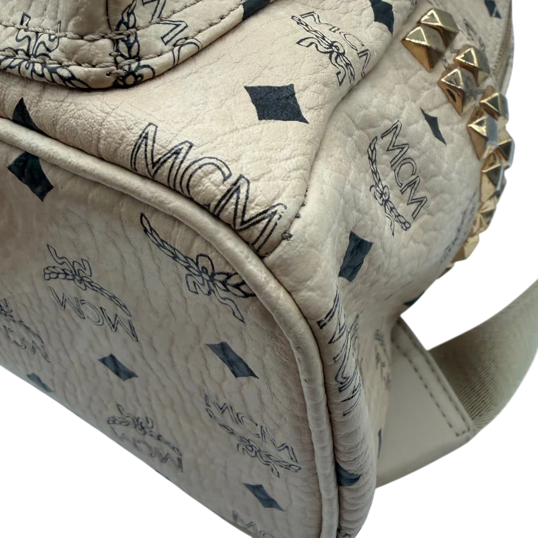 https://cdn.shopify.com/s/files/1/0564/9376/8855/files/MCM_Rucksack_Stark_medium_visetos_beige_vintage8397.webp?v=1781108985