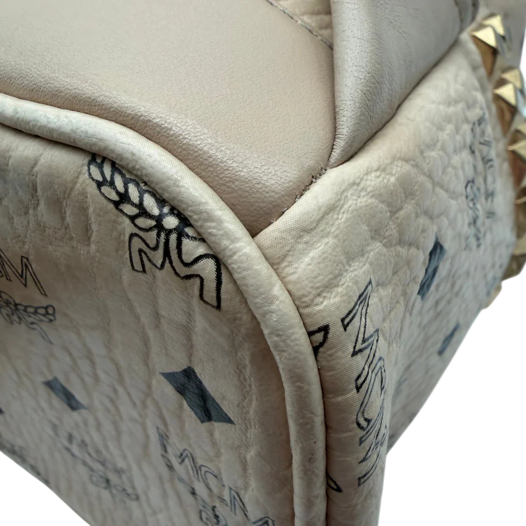 https://cdn.shopify.com/s/files/1/0564/9376/8855/files/MCM_Rucksack_Stark_medium_visetos_beige_vintage8398.webp?v=1781108985