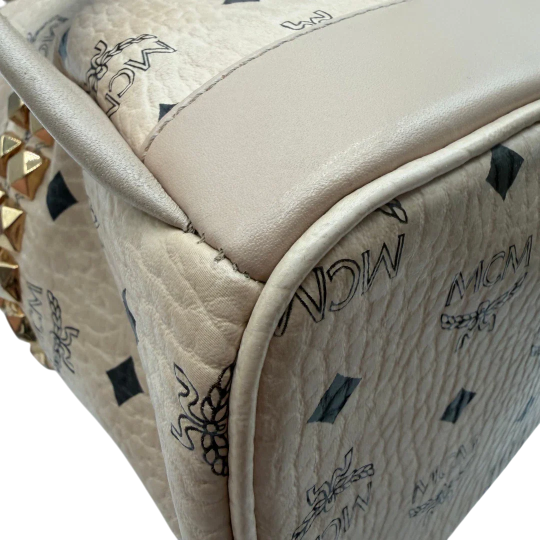 https://cdn.shopify.com/s/files/1/0564/9376/8855/files/MCM_Rucksack_Stark_medium_visetos_beige_vintage8399.webp?v=1781108985
