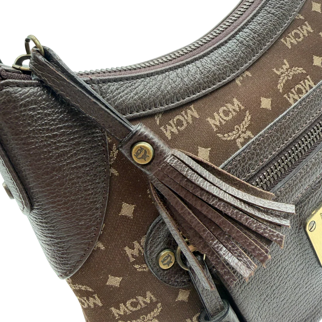 https://cdn.shopify.com/s/files/1/0564/9376/8855/files/MCM_Schultertasche_Hobo_monogram_braun_14.webp?v=1781713303