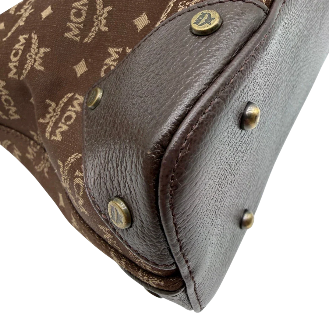 https://cdn.shopify.com/s/files/1/0564/9376/8855/files/MCM_Schultertasche_Hobo_monogram_braun_9.webp?v=1781713303