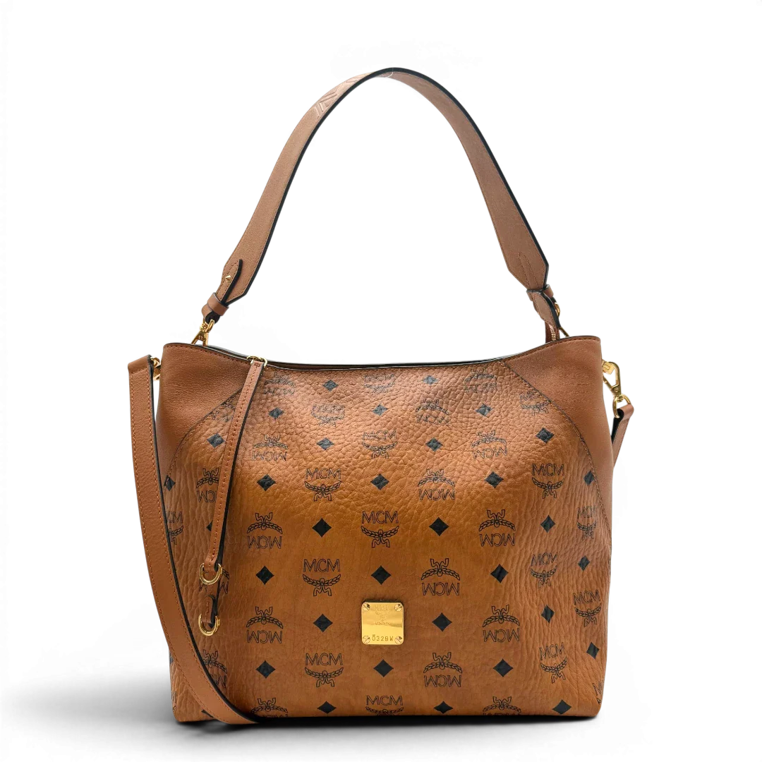 https://cdn.shopify.com/s/files/1/0564/9376/8855/files/MCM_Schultertasche_Hobo_visetos_braun_1.webp?v=1782377855