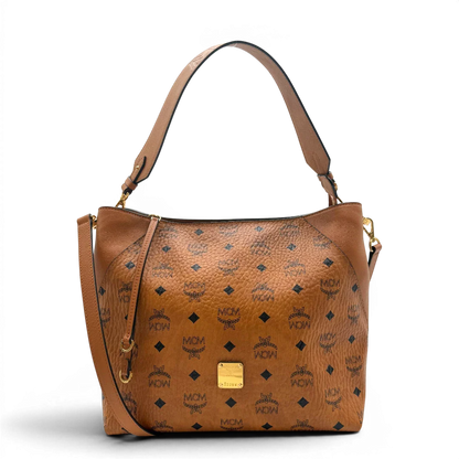 https://cdn.shopify.com/s/files/1/0564/9376/8855/files/MCM_Schultertasche_Hobo_visetos_braun_1.webp?v=1782377855