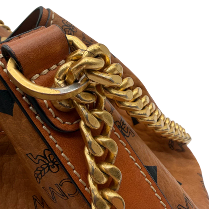 https://cdn.shopify.com/s/files/1/0564/9376/8855/files/MCM_Schultertasche_Soft_Berlin_Bucket_visetos_braun_12.webp?v=1781713453