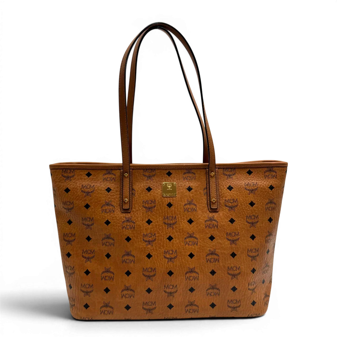 https://cdn.shopify.com/s/files/1/0564/9376/8855/files/MCM_Shopper_Anya_visetos_braun_vintage2348.webp?v=1779969783