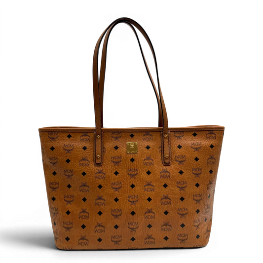 https://cdn.shopify.com/s/files/1/0564/9376/8855/files/MCM_Shopper_Anya_visetos_braun_vintage2348.webp?v=1779969783