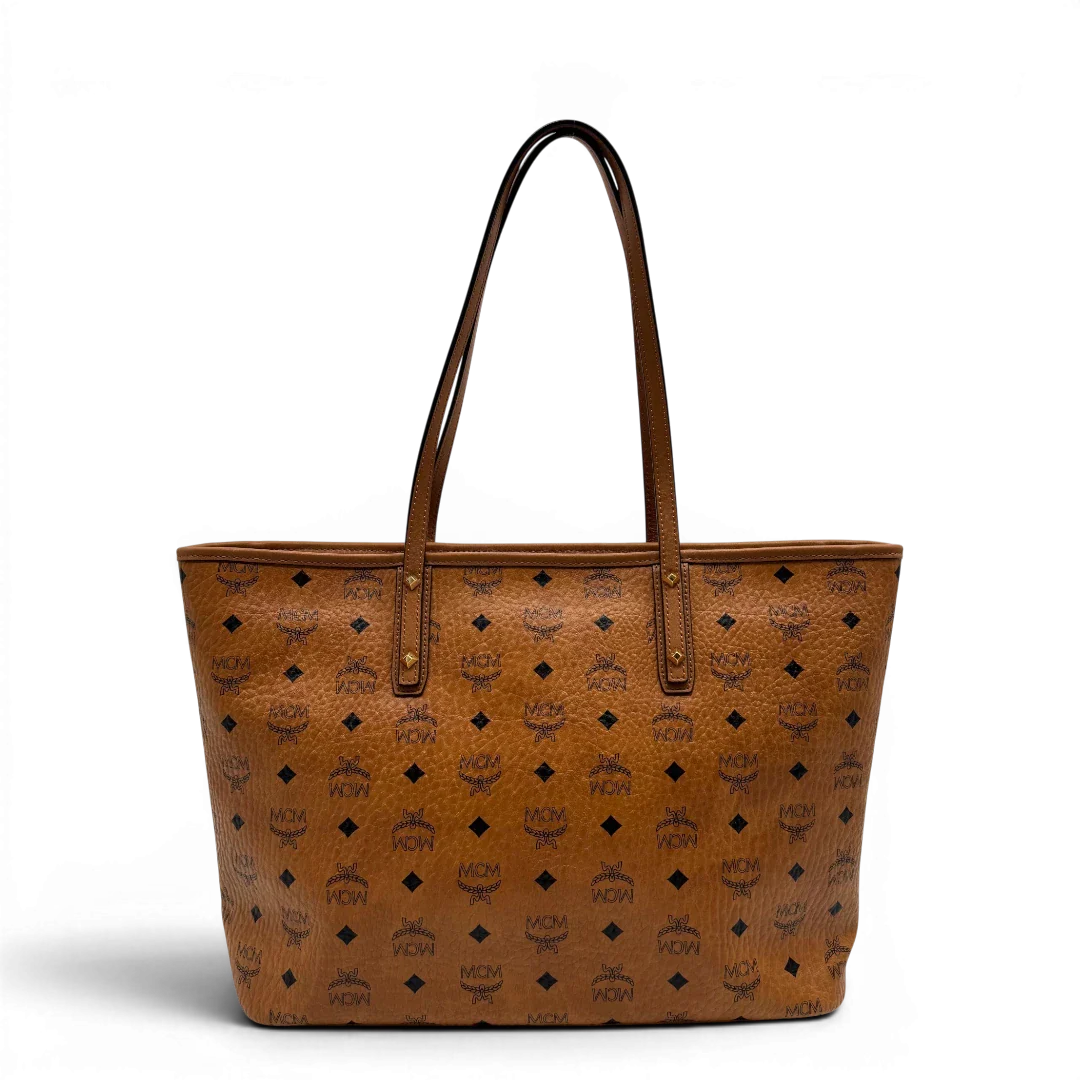 https://cdn.shopify.com/s/files/1/0564/9376/8855/files/MCM_Shopper_Anya_visetos_braun_vintage2353.webp?v=1779969783