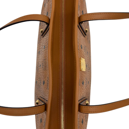 https://cdn.shopify.com/s/files/1/0564/9376/8855/files/MCM_Shopper_Anya_visetos_braun_vintage2363.webp?v=1779969783