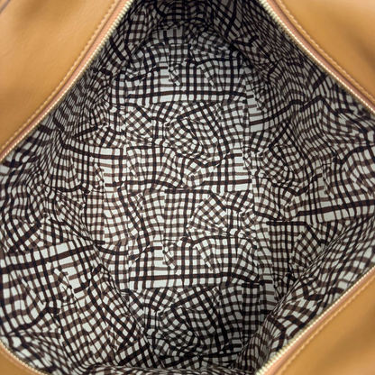 https://cdn.shopify.com/s/files/1/0564/9376/8855/files/MCM_Shopper_Anya_visetos_braun_vintage2364.webp?v=1779969784