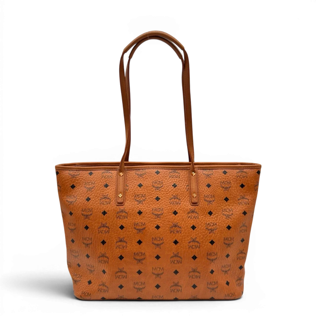 https://cdn.shopify.com/s/files/1/0564/9376/8855/files/MCM_Shopper_visetos_braun_1.webp?v=1784795144
