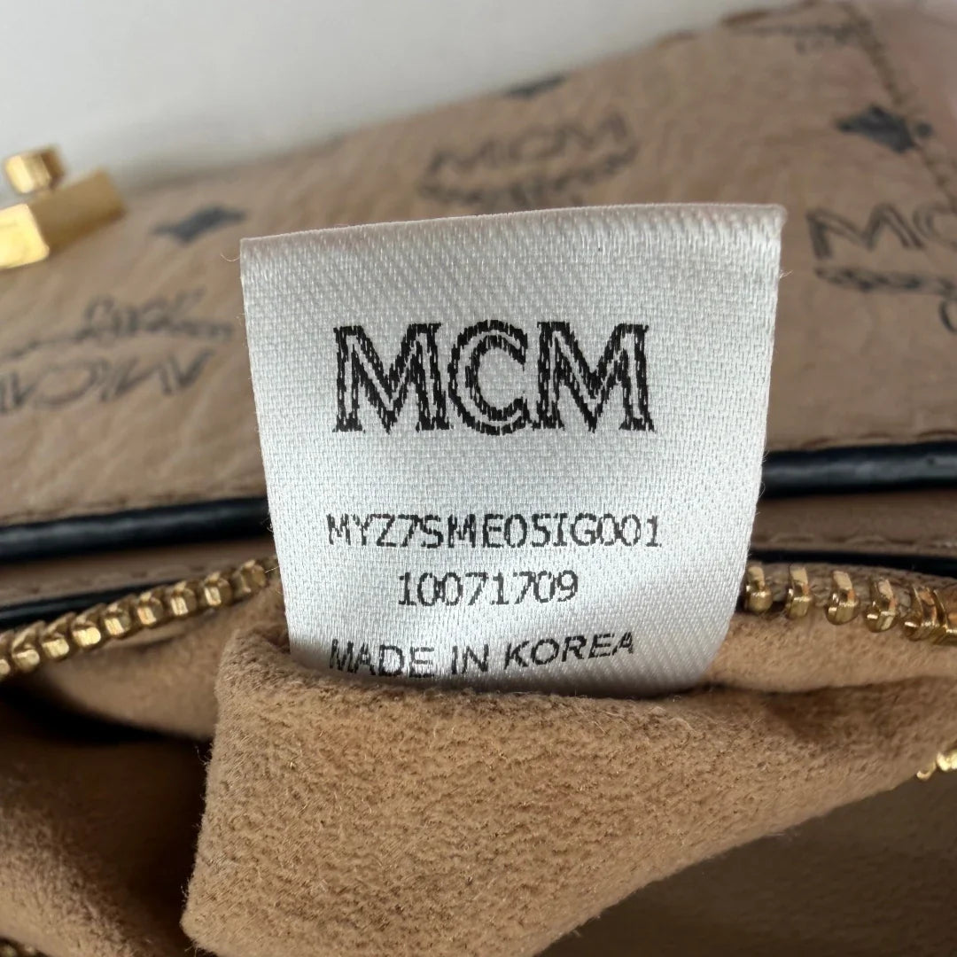 https://cdn.shopify.com/s/files/1/0564/9376/8855/files/MCM_Umhangetasche_Millie_Flap_visetos_beige_19.webp?v=1784795374