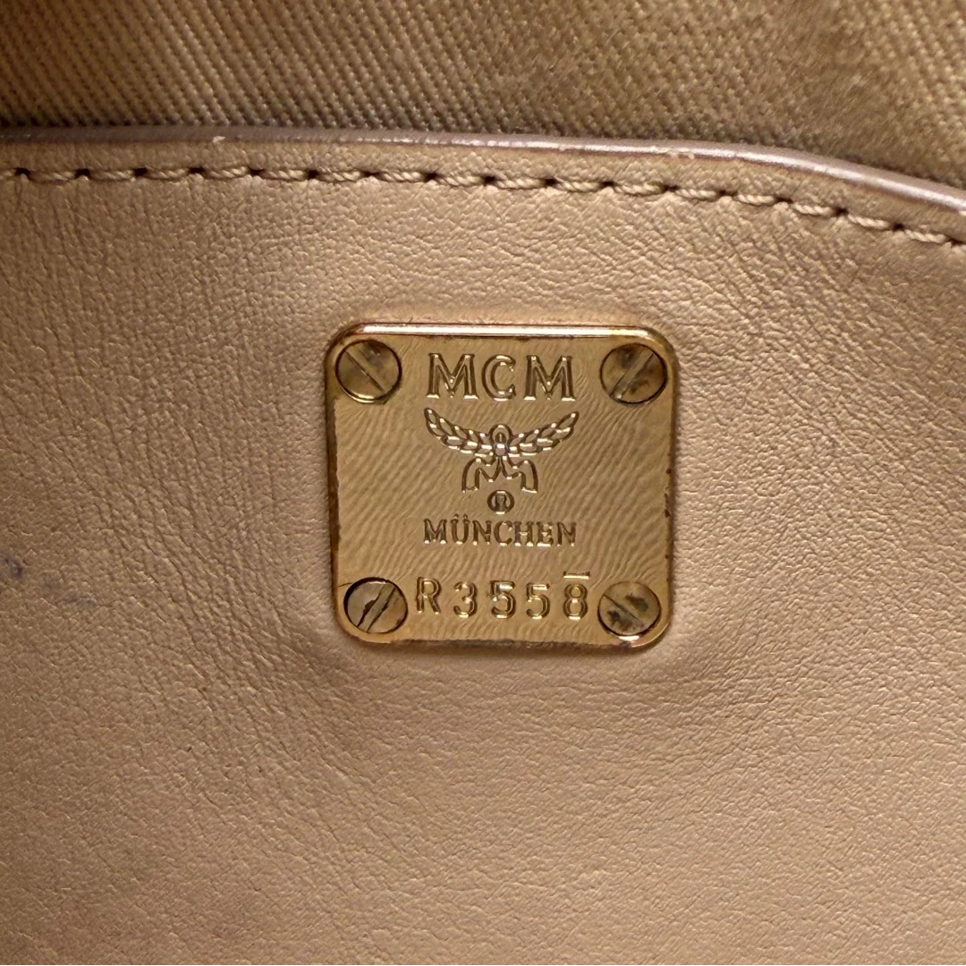 https://cdn.shopify.com/s/files/1/0564/9376/8855/files/MCM_Umhangetasche_Millie_beige_17.webp?v=1784794941