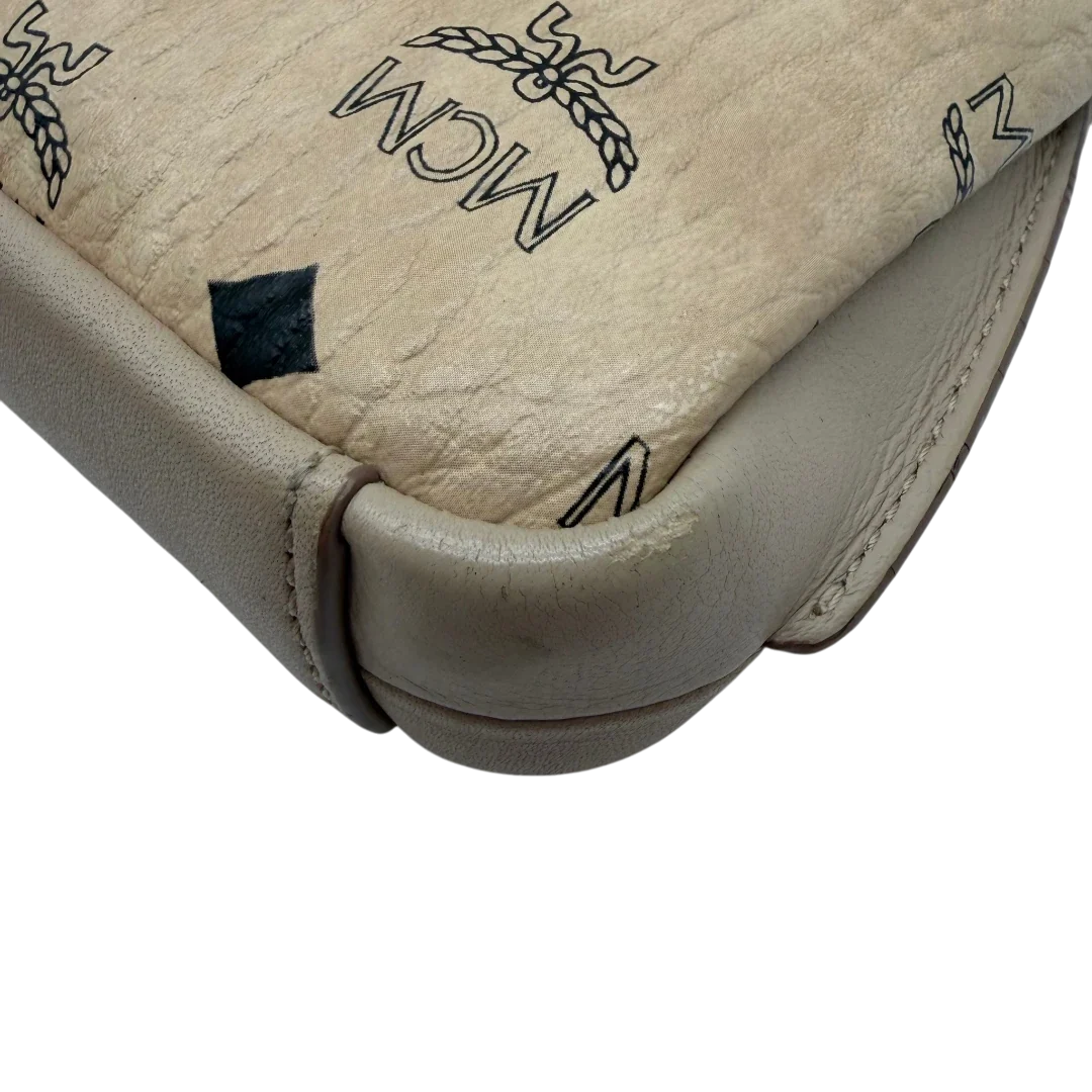 https://cdn.shopify.com/s/files/1/0564/9376/8855/files/MCM_Umhangetasche_Millie_beige_8.webp?v=1784794941