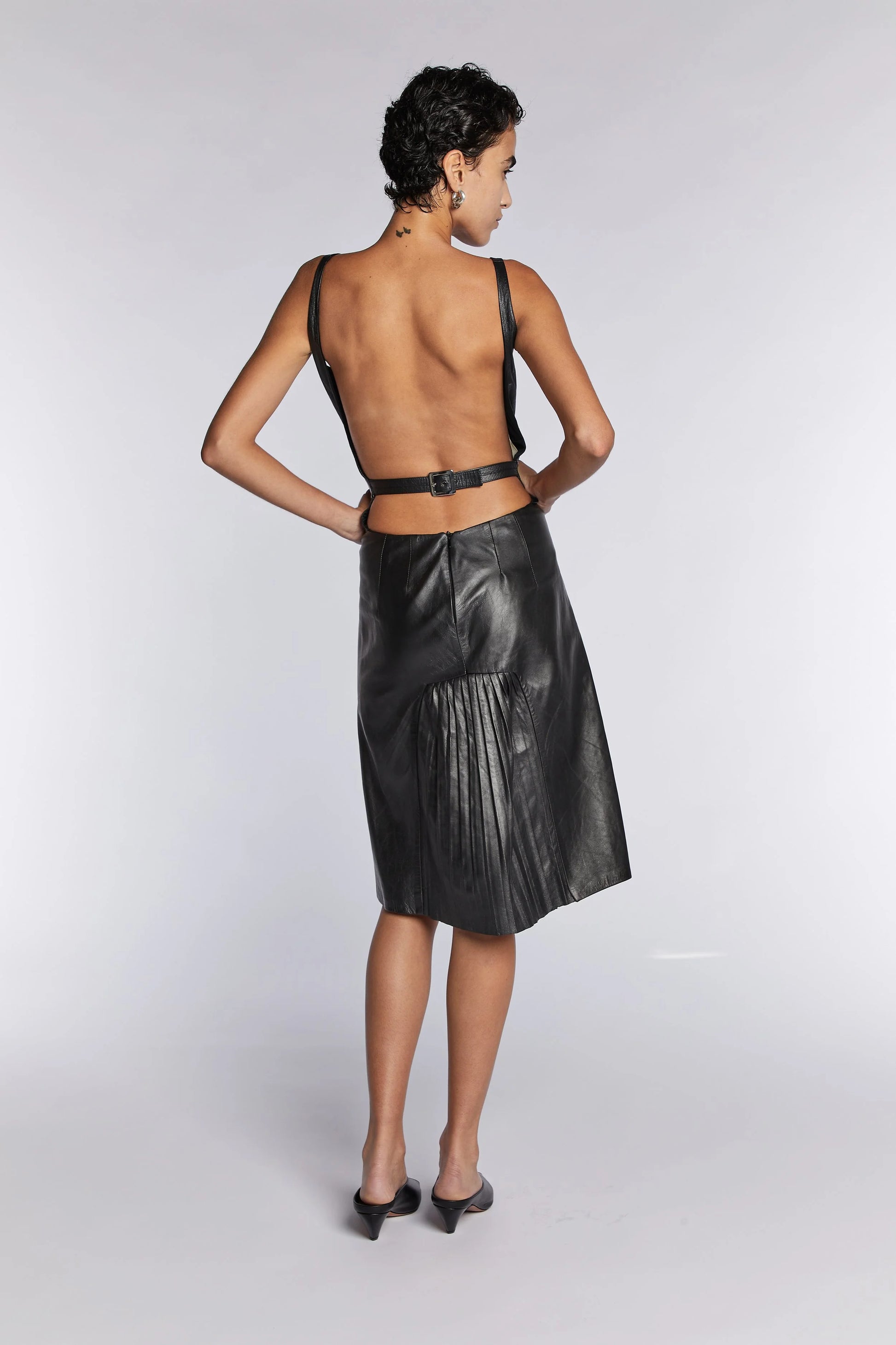 alexander mcqueen leather dress A black corset dress with a deep knife pleat skirt is edged with sharp laser-cut engineered roses. From the Autumn/Winter 2019 collection: https://t.co/KsSxRIJlAn #McQueenAW19 #AlexanderMcQueen