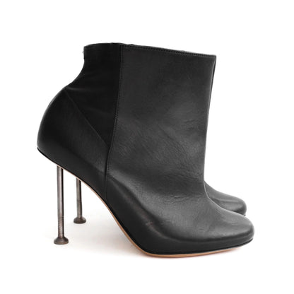 Maison Martin Margiela FW 2008 leather ankle boots with nail stiletto heels and round toe. Size EU 37 / UK 4. Available at Artefact Archive.