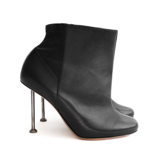 Maison Martin Margiela FW 2008 leather ankle boots with nail stiletto heels and round toe. Size EU 37 / UK 4. Available at Artefact Archive.
