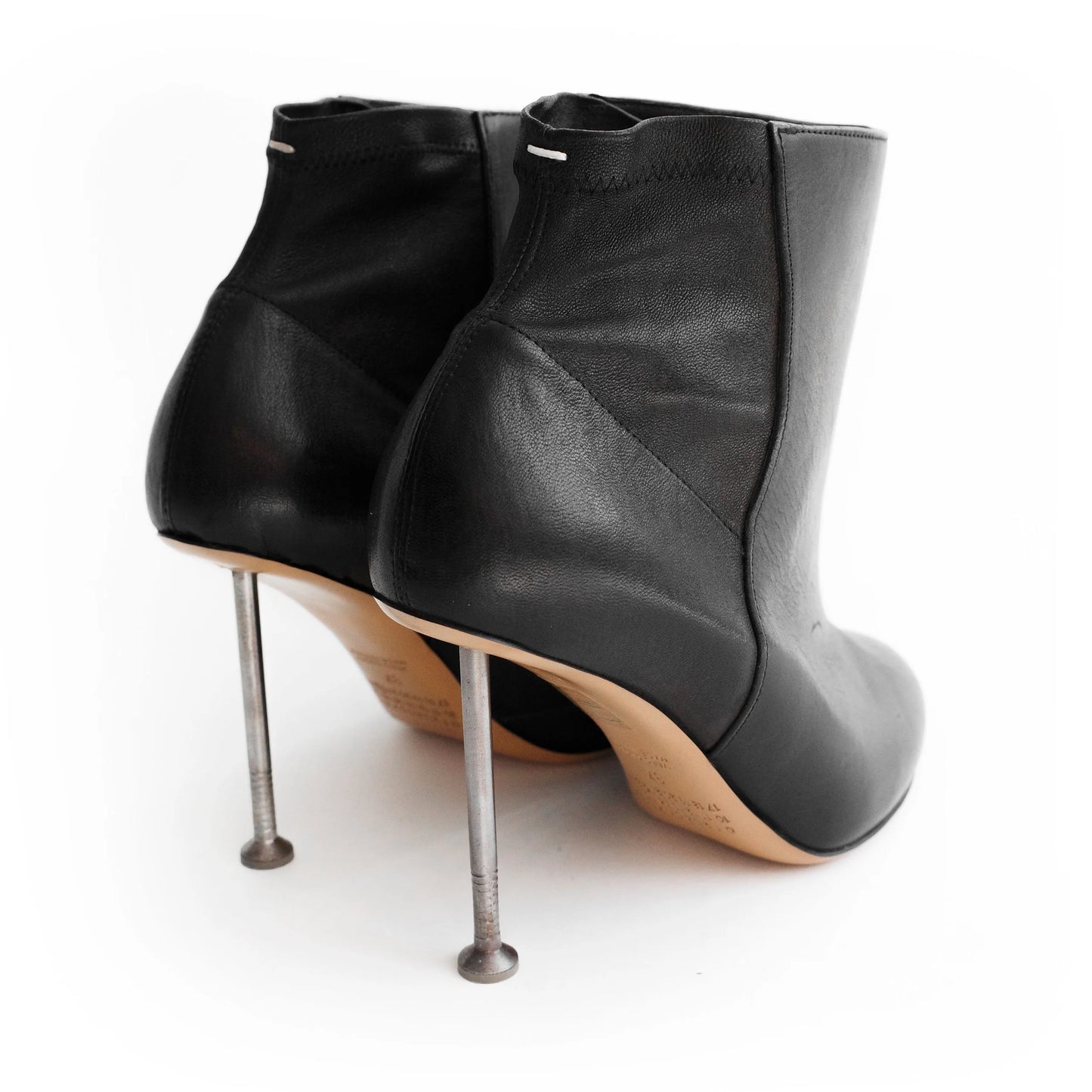 Maison Martin Margiela FW 2008 leather ankle boots with nail stiletto heels and round toe. Size EU 37 / UK 4. Available at Artefact Archive.