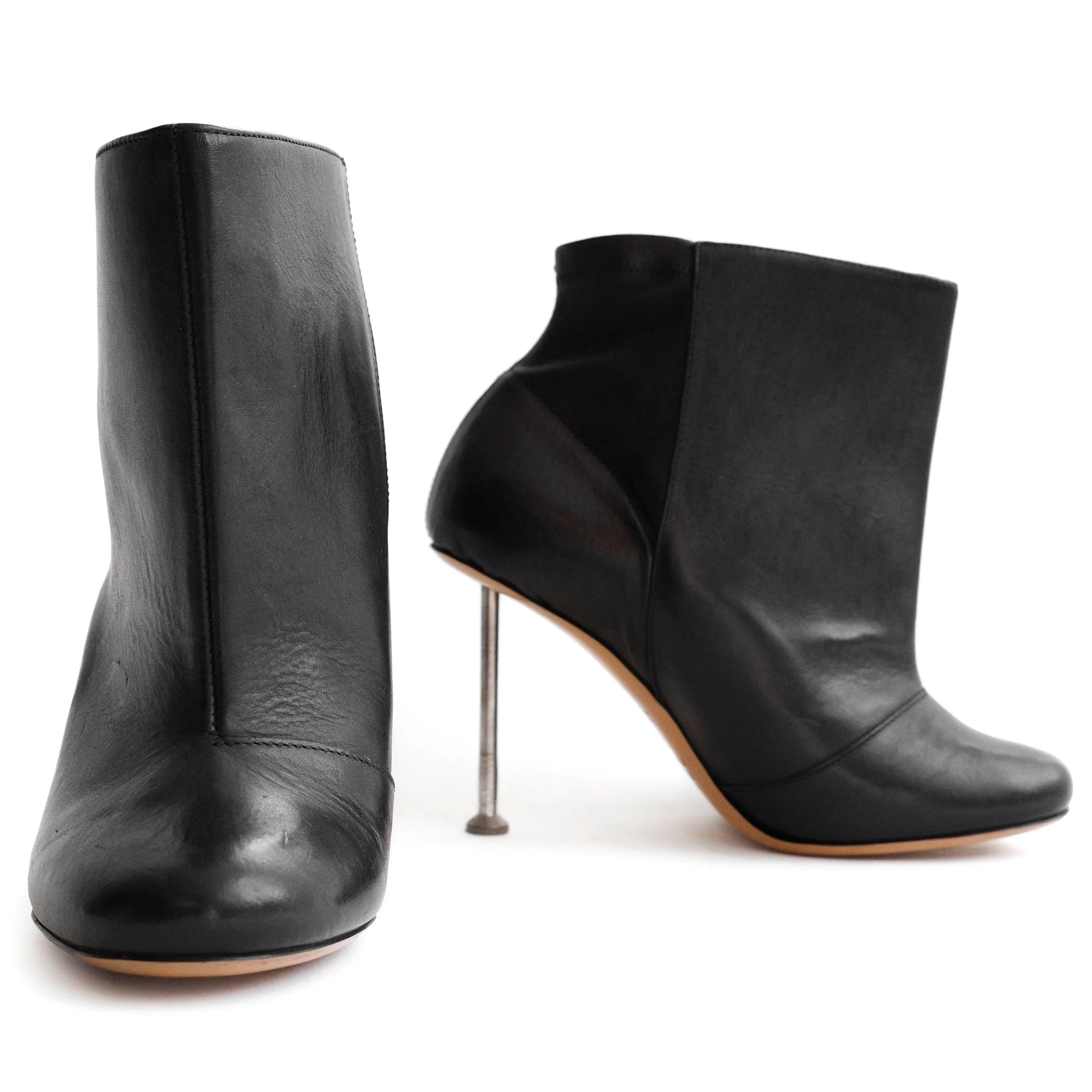 Maison Martin Margiela FW 2008 leather ankle boots with nail stiletto heels and round toe. Size EU 37 / UK 4. Available at Artefact Archive.