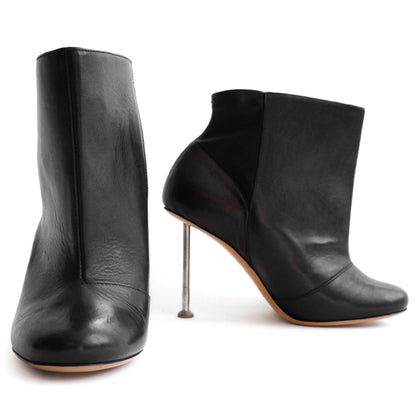 Maison Martin Margiela FW 2008 leather ankle boots with nail stiletto heels and round toe. Size EU 37 / UK 4. Available at Artefact Archive.