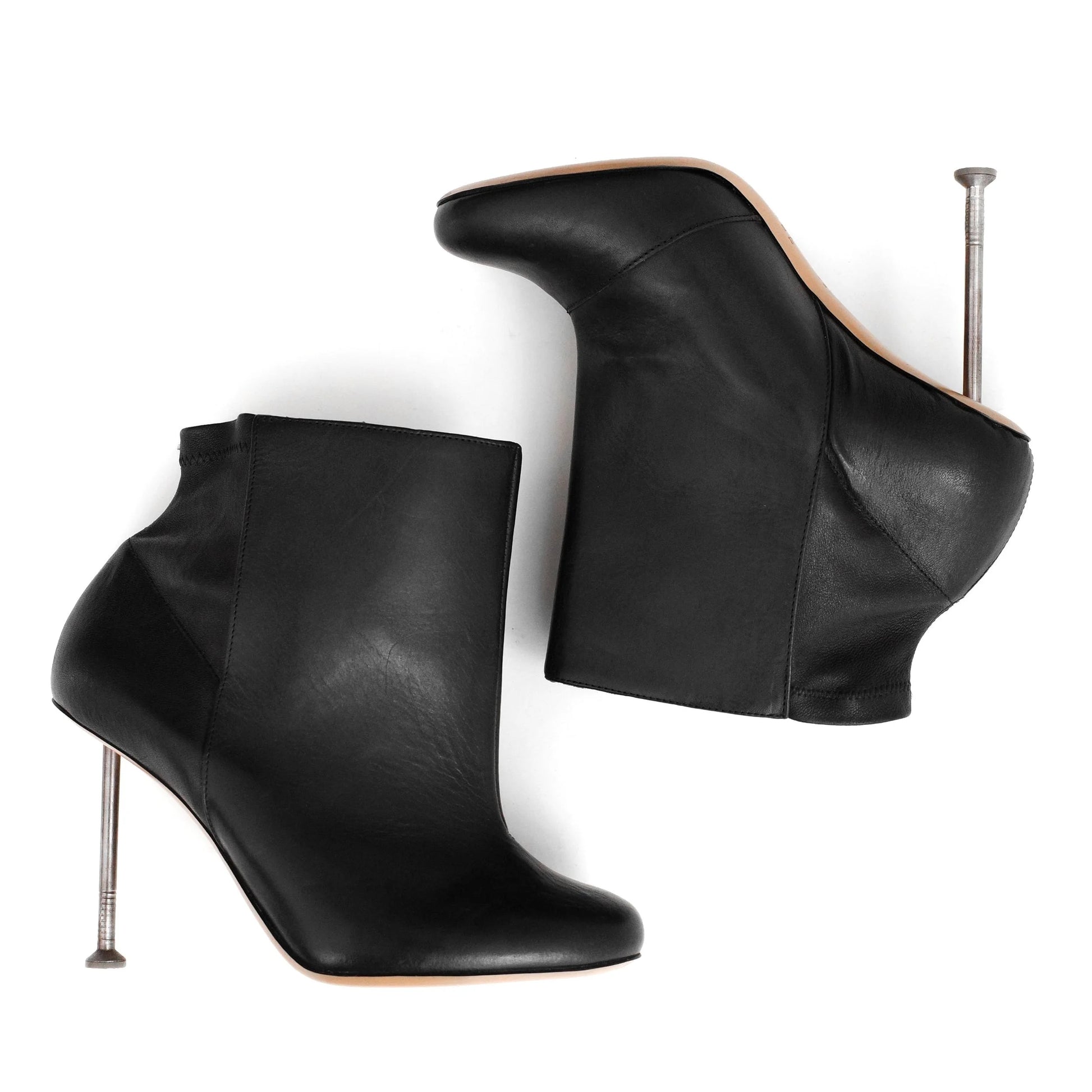 Maison Martin Margiela FW 2008 leather ankle boots with nail stiletto heels and round toe. Size EU 37 / UK 4. Available at Artefact Archive.
