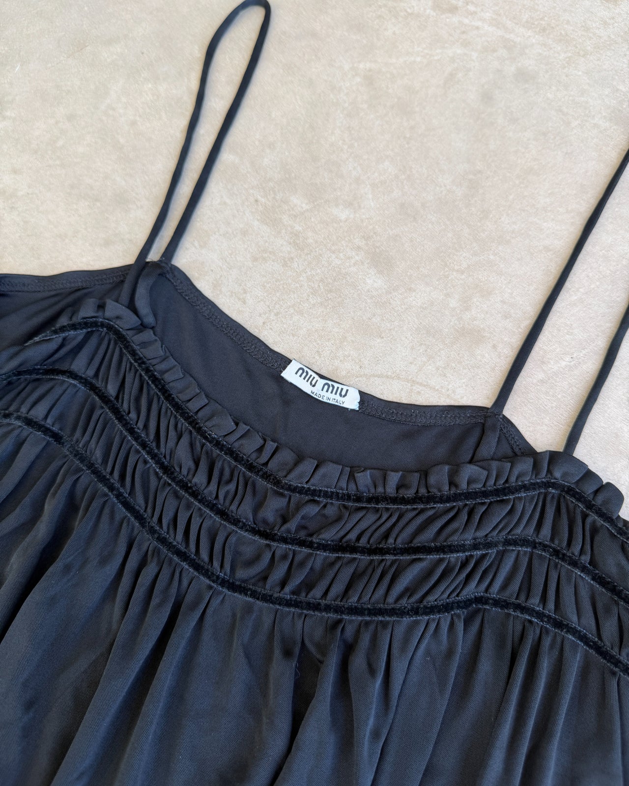 Miu Miu Black Acetate Nylon Blend Top – S-on a concrete background