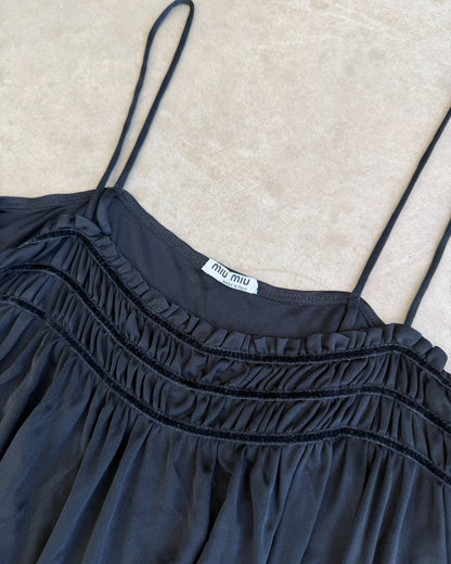 Miu Miu Black Acetate Nylon Blend Top – S-on a concrete background