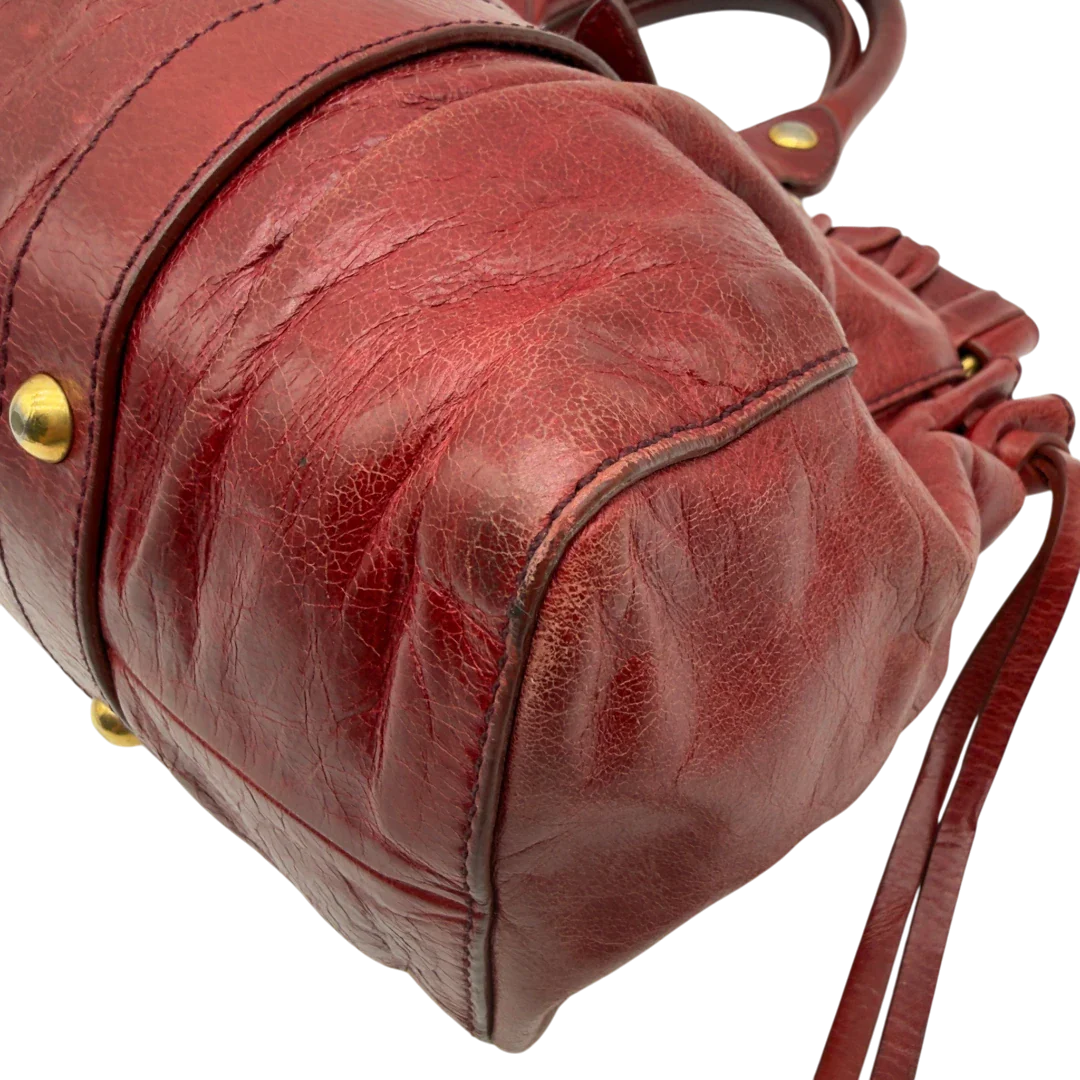 https://cdn.shopify.com/s/files/1/0564/9376/8855/files/Miu_Miu_Handtasche_Vitello_Lux_aus_Leder_dunkelrot_vintage7260.webp?v=1778681884
