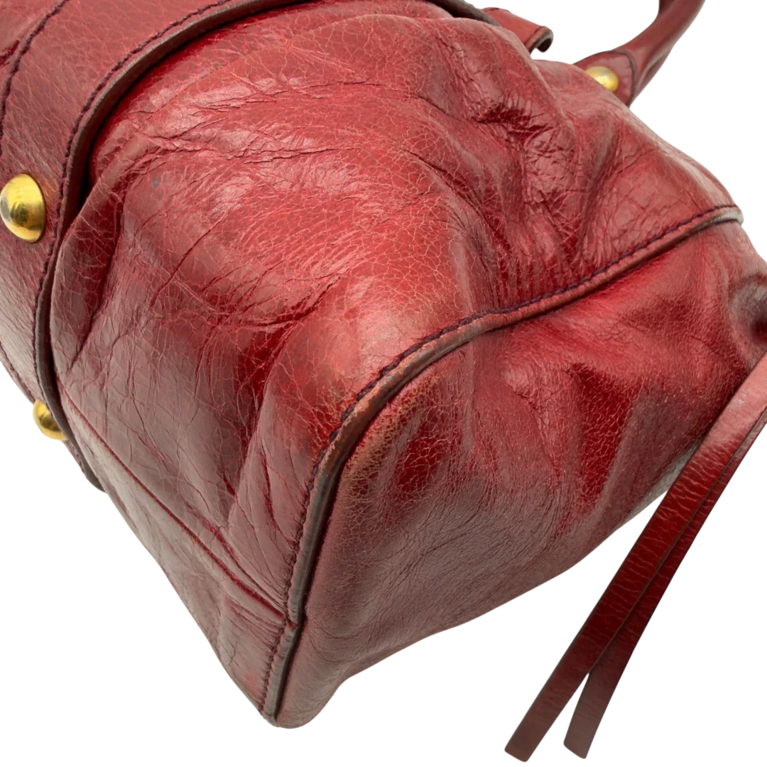 https://cdn.shopify.com/s/files/1/0564/9376/8855/files/Miu_Miu_Handtasche_Vitello_Lux_aus_Leder_dunkelrot_vintage7262.webp?v=1778681884